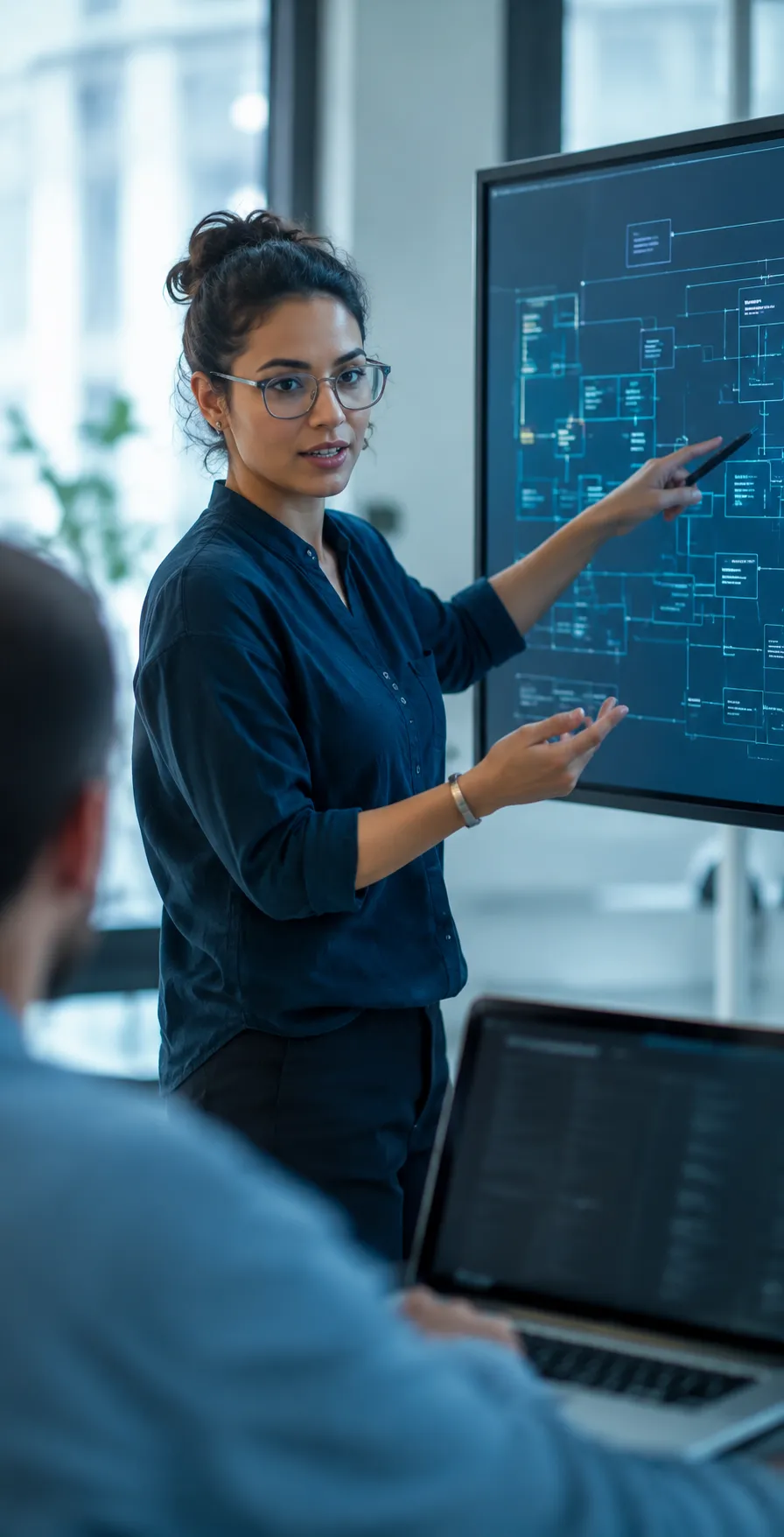AimAnalitica engineer reviewing a system diagram